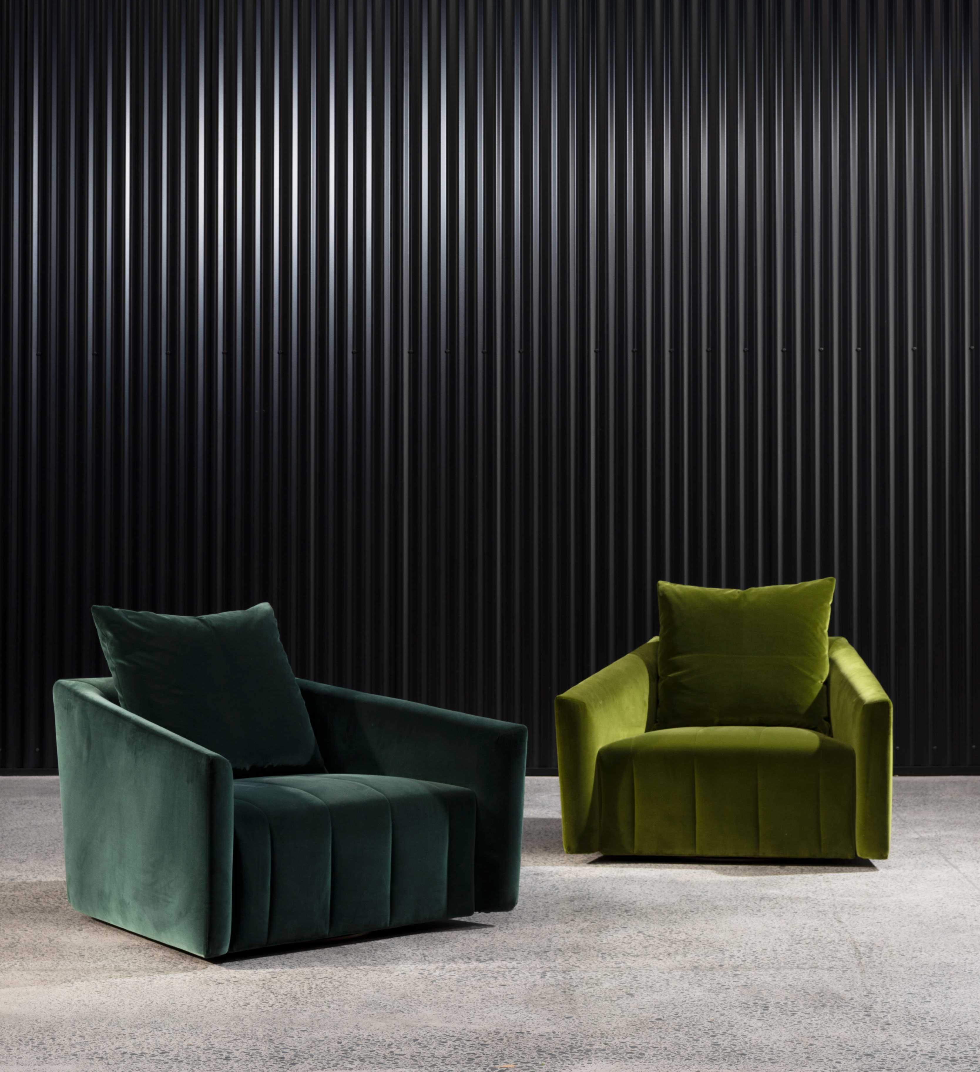 Two Belladonna lounge chairs. One in dark green, the other light green.