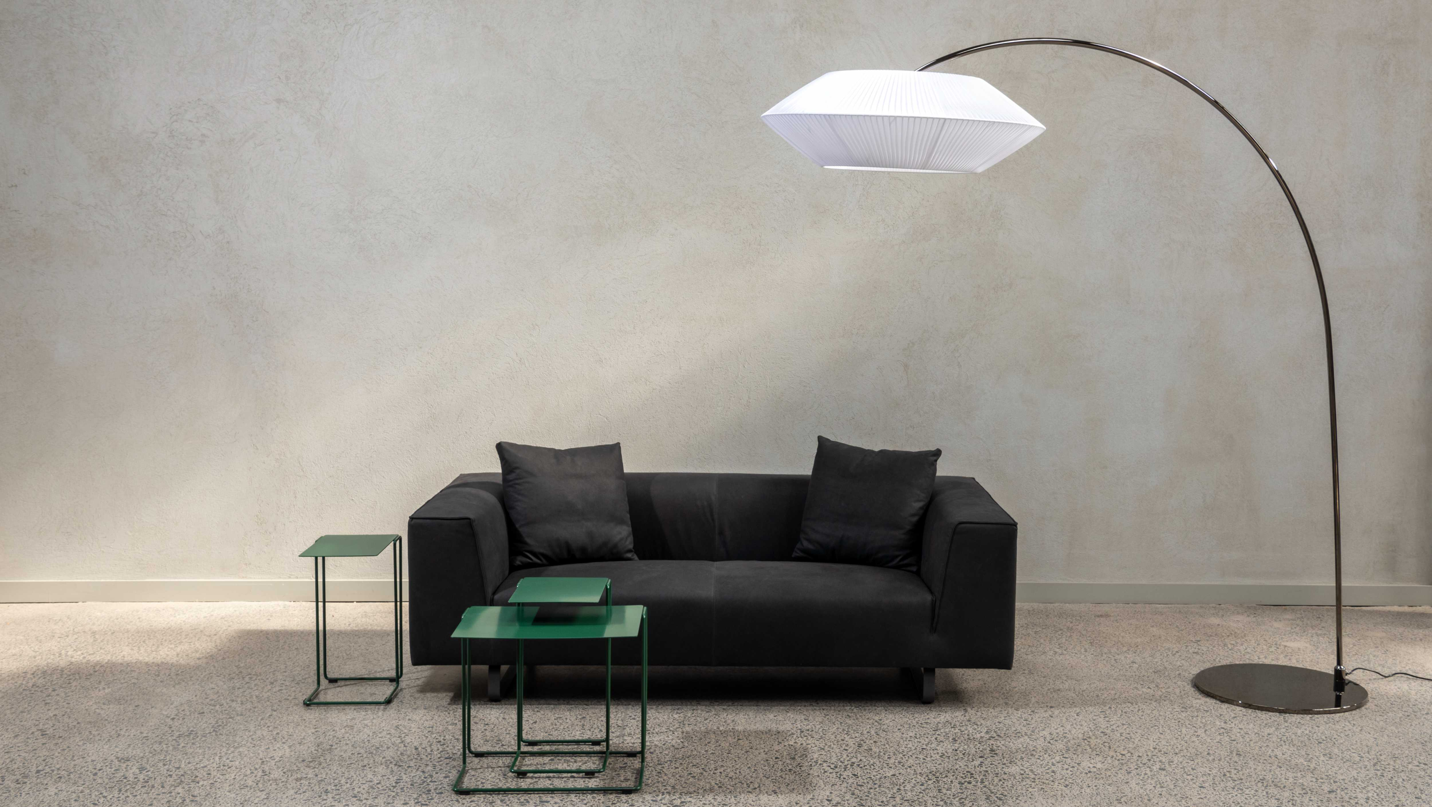 Modena sofa and Arte Arc floor lamp with side tables. Italian made accessories.