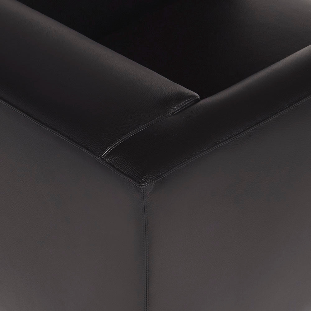 Modena luxury leather armchair in black. Closeup view.