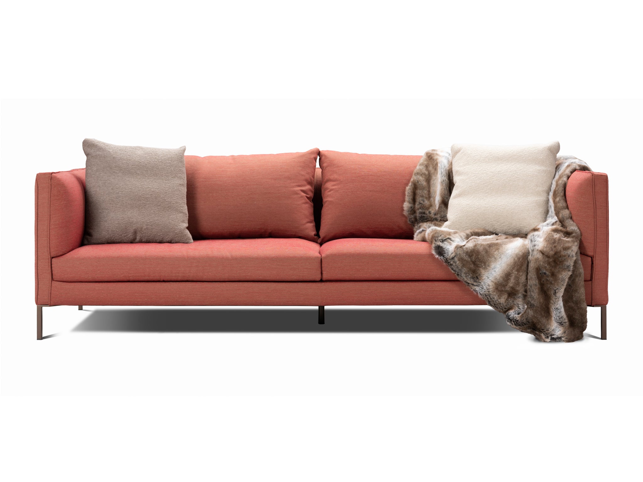 Siena sofa in rosso burgundy colour with pillow cushions and rug. Front view.