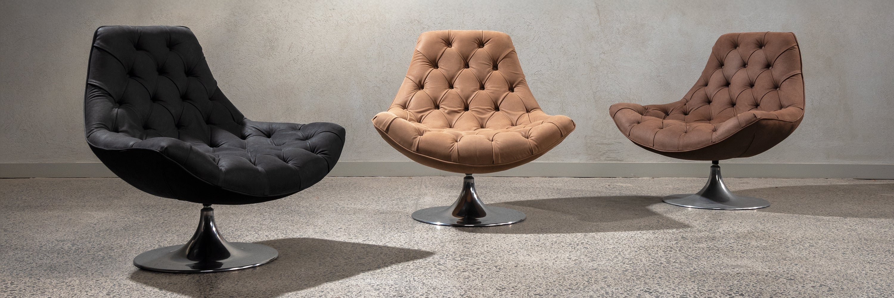 Three Venezia swivel chairs in showroom.